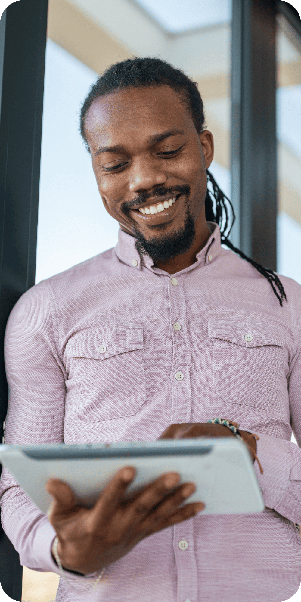 Man looking at tablet smiling